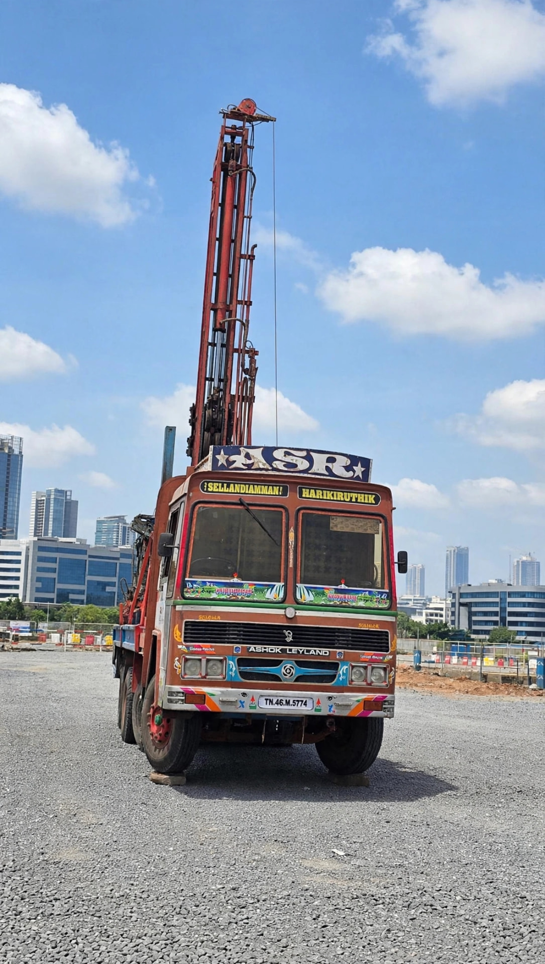 Shiv Shakti borewell rig truck parked with mast raised on an open site